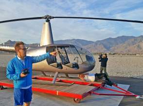 Film crew preparing shot with helicopter