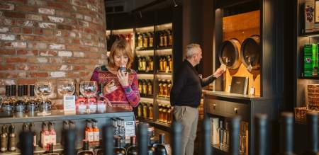 A couple looking around Penderyn Whisky distillery.