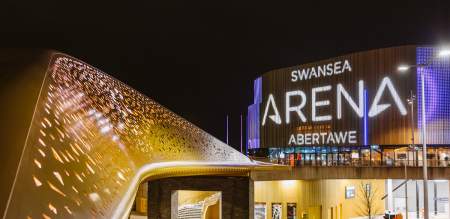 Swansea arena entrance lit up at night