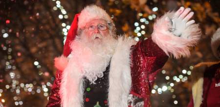 Father Christmas waving from his sleigh in the Swansea Christmas Parade