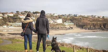 Couple walking their dog in the winter