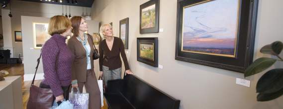 Ladies browsing art gallery