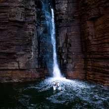 Cruise in close to thundering waterfalls carved into ancient rock.