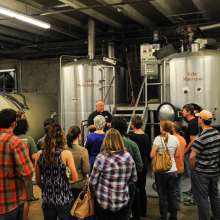 Visitors listen intently during a Tin Roof Brewery tour in Baton Rouge, Louisiana.