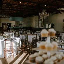 room with tables decorated for a wedding reception