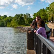 family at an overlook along the Riverwalk