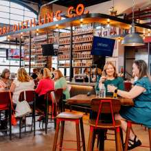 People enjoying food and drinks at the restaurant at Old Glory.
