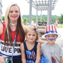 kids dressed in red, white and blue for a  4th of July celebration