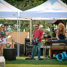 A local band. There are drums, a bass guitar, an electric guitar, and a keyboard.