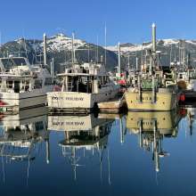 Reflections of boats at the Haines downtown Harbor