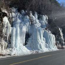Frozen spring water stream along Mud Bay road