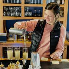 Payson Clark pouring drinks at Port Chilkoot Distillery