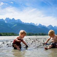 Babies playing on the chilkat side on the flats