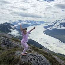 Dancing our way to the top of Chilly Ridge, child posing over the valley from Chilly Ridge
