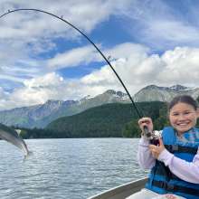 Child Fishing with fish on pole - Middle of chilkat lake