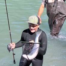 Father and son fishing, salmon in net, chilkoot lake