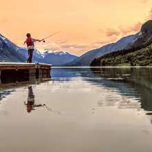 boy fishing at dusk Chilkoot lake boat launch