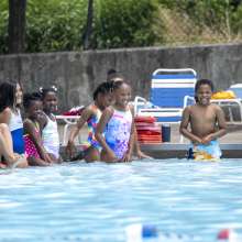 Group of kids learning to swim