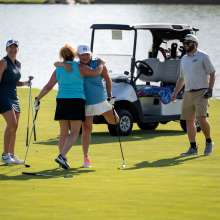 Indiana Sports Corp - Golfers Celebrate