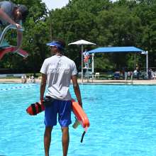 Lifeguard watching over a pool