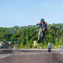 Biker jumping at the pump track
