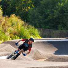Kid riding in pump track