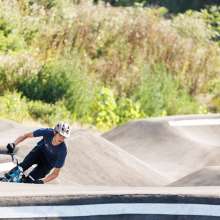 Kid riding in pump track