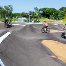 4 riders using the pump track
