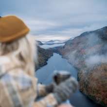 woman looks out at a fjord