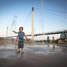 Children Playing in Splash Area at Base of Bob the Bridge