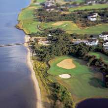 Aerial view of a golf course along the coast in the Outer Banks