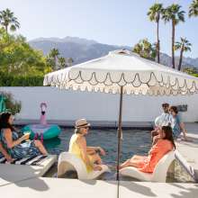 Group around pool at vacation rental.