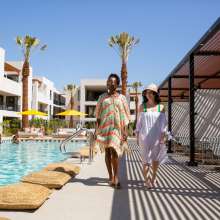 Two women poolside at the Drift Hotel