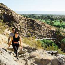 Two people hiking on Lykken trail.