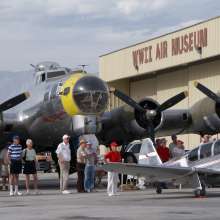 Group around a WWII plane at the Palm Springs Air Museum