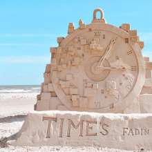 Clock sculpture made of sand.