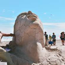 Man Working on Sand Sculpture