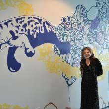Photo of public artwork, undersea wall mural featuring manatees and turtles