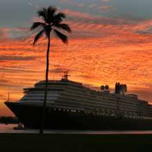 Ship sailing off beach