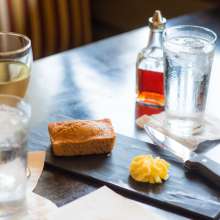 Glasses, bread and butter on a table