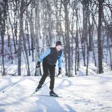 A man cross country skiing at Standing Rocks County Park in Stevens Point, WI