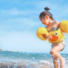 Child splashing on beach