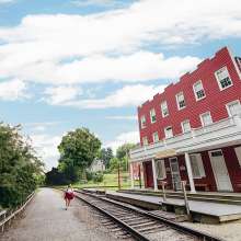 a walker enjoying the views at Hanover Junction along the Heritage Rail Trail