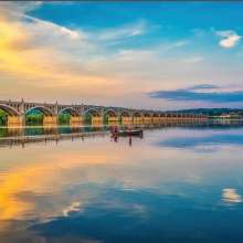 people boating at sunset along the Susquehanna River
