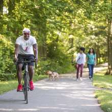 People biking and walking along the rail trail