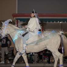 Women from Saddles of Joy dress as aurora from Disney's Maleficent on top of her horse with matching attire