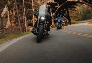 motorcycles taking the corners of the pigtails on iron mountain road in the black hills