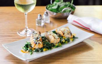 Salmon dish and white wine at Bulla Gastrobar