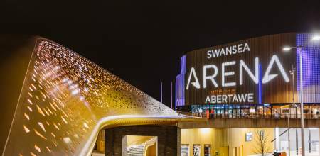 Swansea arena entrance lit up at night