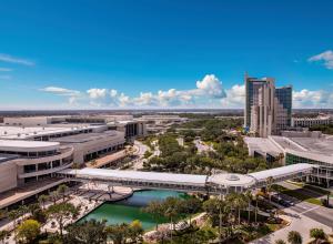 Aerial shot of the Orange County Convention Center and Hyatt Regency Orlando on International Drive during the day